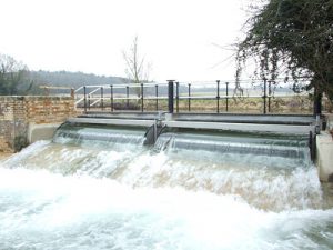 Beamed tilting weir on the Kennett and Avon canal in Berkshire. UK