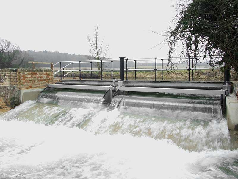 Beamed tilting weir on the Kennett and Avon canal in Berkshire. UK